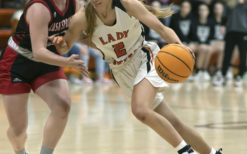 Sterling senior Emma Nunley (2) dribbles past a Rush Springs defender in last Friday’s win. Sterling is now 18-4 for the season.  HUGH SCOTT JR. | SOUTHWEST CHRONICLE