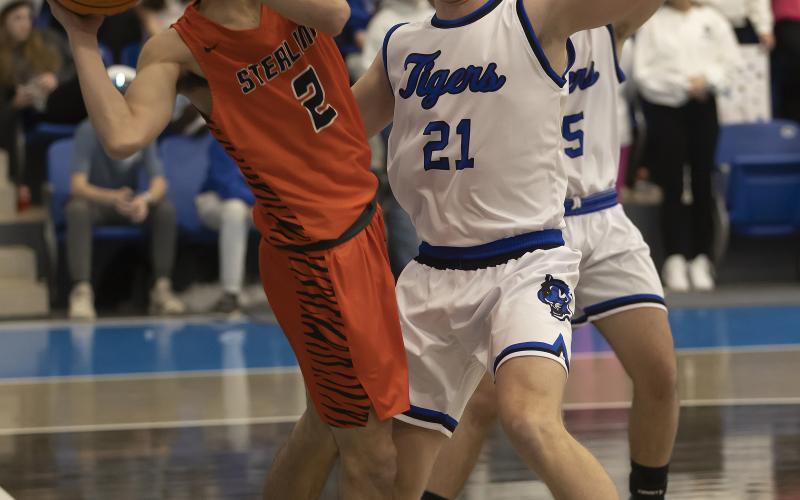 Tiger Max Puccio saves the ball from going out of bounds during regional action against Union City.  HUGH SCOTT JR. | SOUTHWEST CHRONICLE
