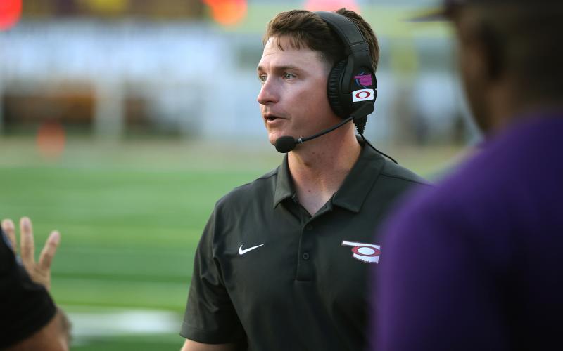 Elgin head football coach Chalmer Wyatt roams the sideline during a 2022 game. Wyatt, who was selected as Region 4 Coach of the Year, led the Owls to an 8-3 record and a spot in the playoffs for the first time in five years. HUGH SCOTT JR. | SOUTHWEST CHRONICLE