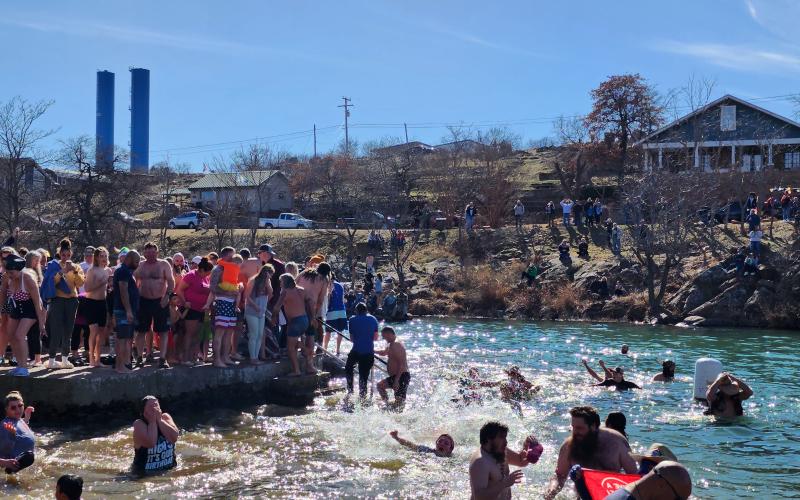 About 200 people braved the not-quite-freezing water of Bath Lake last Saturday to take part in Medicine Park’s annual Polar Plunge. STEVE BOOKER | SOUTHWEST CHRONICLE