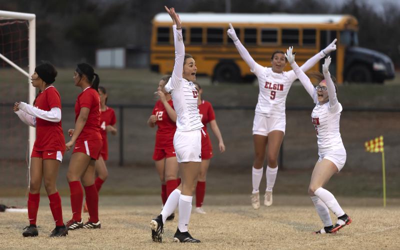 Elgin players Emma Rhinhart, Joanie Kenny and Mikaela Scholl celebrate a second half goal against McLoud Tuesday night. Elgin’s 6-1 win improved its record to 2-1. HUGH SCOTT JR. | SOUTHWEST CHRONICLE