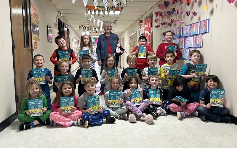 To help celebrate Read Across America Day, Friends of Elgin Community Library member Jeanne Cook reads the Dr. Seuss classic Green Eggs and Ham to Mrs. Ashlyn McCall’s first grade class in Sterling. Students read along and picked out rhyming words. CURTIS AWBREY | SOUTHWEST CHRONICLE