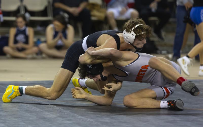 Elgin’s Hunter Jackson dominates Coweta’s Toby Shipman in the first round of the Class 5A 113-pound title match at last Saturday’s state tournament. However, Shipman prevailed 3-2 to win the state crown. HUGH SCOTT JR. | SOUTHWEST CHRONICLE