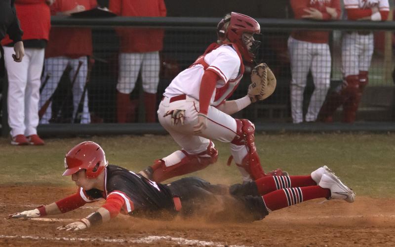 Elgin baserunner Mason Thornton slides home during the season opener March 3 against Carl Albert. HUGH SCOTT JR. | SOUTHWEST CHRONICLE
