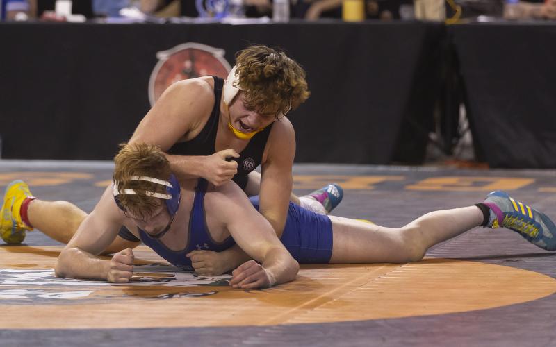 Elgin freshman Ritson Meyer (top) takes control of the 190-pound match against Glenpool’s Kevin Lund during last week’s Class 5A state meet. Meyer defeated Lund 3-0 to win the state championship. HUGH SCOTT JR. | SOUTHWEST CHRONICLE
