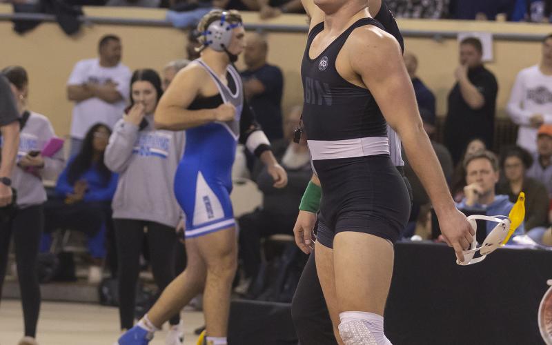 Ritson Meyer is proclaimed the champion of the 190-pound weight class during last week’s state meet. HUGH SCOTT JR. | SOUTHWEST CHRONICLE
