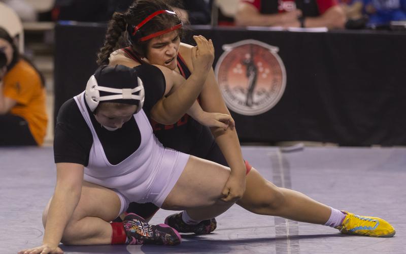Elgin junior Symphony Veloz puts Fort Gibson’s Peighton Mullins in an arm lock during their 170-pound match during the girls Class 6A state championship match last week at the Jim Norick Arena in Oklahoma City. Veloz won on a one-point escape with 15 seconds remaining in the match. HUGH SCOTT JR. | SOUTHWEST CHRONICLE