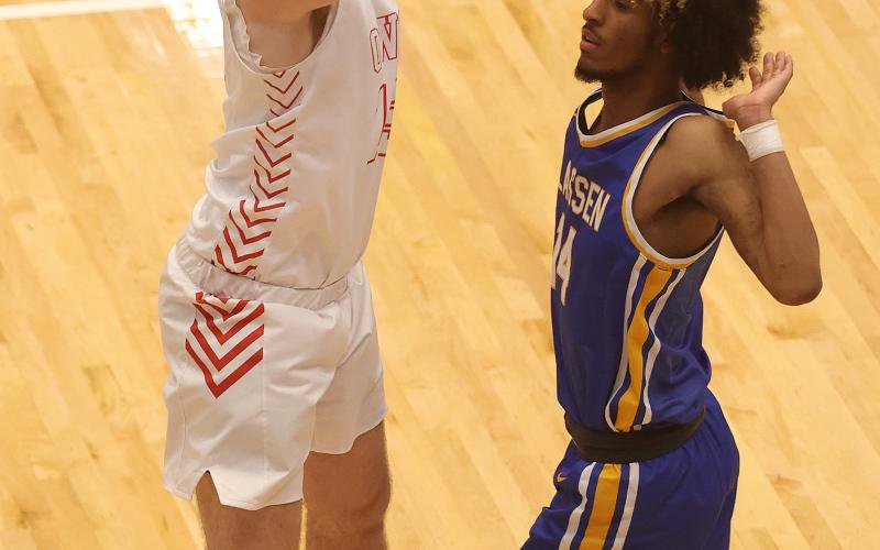 Elgin’s Tres Lorah takes a three-point shot during the Area Tournament game against Classen SAS. Classen defeated Elgin 50-39 and eliminated the Owls from the Class 4A playoffs. HUGH SCOTT JR. | SOUTHWEST CHRONICLE