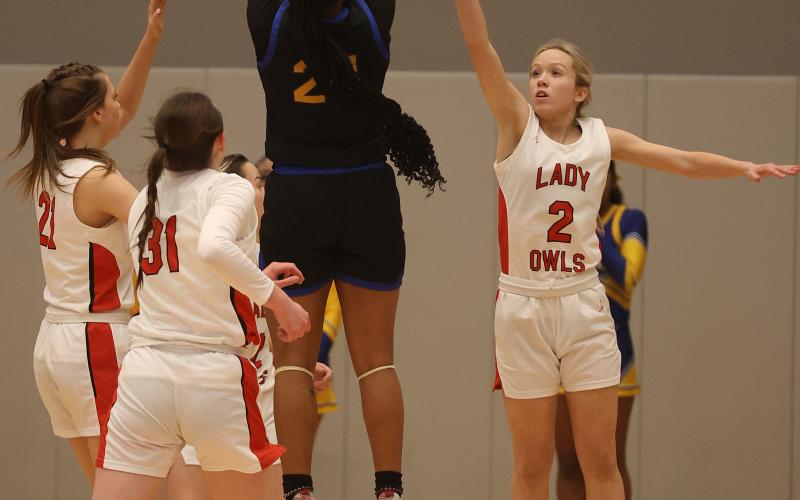 Elgin senior Kenley York guards a Classen SAS player during the Area Tournament March 2 in Hennessey. Classen powered past Elgin 49-27. HUGH SCOTT JR. | SOUTHWEST CHRONICLE