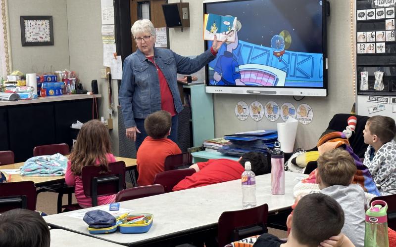 Fletcher first grade students from Ms. Dusty Strange and Mrs. Jamie White’s classes celebrate Read Across America Day as Friends of Elgin Community Library member Debbie Thomason, who also chairs the Dr. Seuss committee, reads “What Pet Should I Get?” Read Across America annually honors the world-renowned children’s author and illustrator Dr. Seuss on his birthday, March 2. DUSTY STRANGE AND JAMIE WHITE