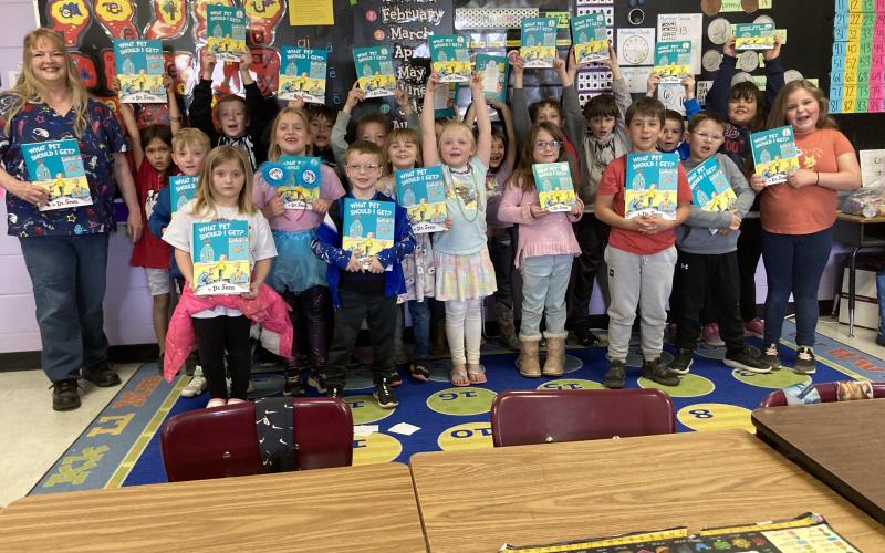 Fletcher first grade students from Ms. Dusty Strange and Mrs. Jamie White’s classes celebrate Read Across America Day as Friends of Elgin Community Library member Debbie Thomason, who also chairs the Dr. Seuss committee, reads “What Pet Should I Get?” Read Across America annually honors the world-renowned children’s author and illustrator Dr. Seuss on his birthday, March 2. DUSTY STRANGE AND JAMIE WHITE