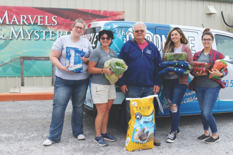 In addition to the produce, Hilliary Communications donated an extra $2,000. The monetary donation is expected to cover animal food costs at the aquarium for one month. On Monday, April 6, Medicine Park Aquarium & Natural Sciences Cen- ter staff, Nicole Rowe, Rainette Rowland, Doug Kemper, Nicole Hill and Jacey Smith scooped up armfuls of donated produce and feed, ready to deliver it to the variety of animal species housed at the aquarium.