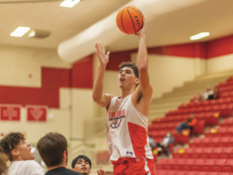 RISING UP: Jayden Parker rises above the crowd during Elgin’s scrimmage Carnegie on Nov. 14, 2020.