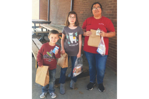 Qualified to provide meals to students during the recent closures due to COVID-19, Fletcher Public Schools has been handing out to-go sack lunches for kids in the district. On Tuesday, March 24, FPS senior Lauren Givens, Leila Kerrick, fifth grade, and Matthew Givens, Pre-K, walked to the school to retrieve their sack lunch.