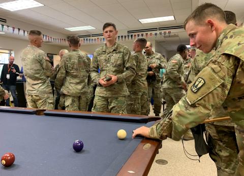 Soldiers enjoy the pool table and other recreation inside the newly opened B.O.S.S. House at Fort Sill. Sgt. Tyler Yount, B.O.S.S. president, said the house is designed to offer single Soldiers a place to decompress and socialize. He said they also focus on volunteer opportunities to connect with the Lawton-Fort Sill community and will soon offer weekly professional development classes.   FORT SILL PHOTO