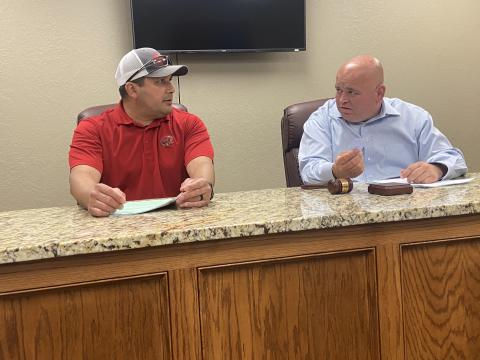 : From the left, Elgin City Councilman Fred Guevara and Mayor JJ Francais discuss an issue during a council meeting April 21 at Elgin City Hall. The council voted to earmark the city’s entire ARPA allocation for government services.  Eric Swanson/Staff photo