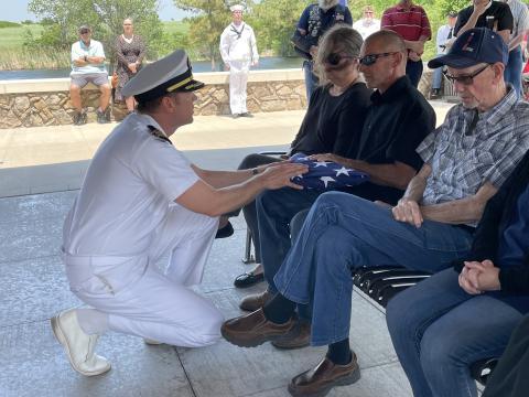 Jeremy Sarratt, longtime family friend accepts a flag for Seaman Kenneth McAbee.SW Chronicle photos by Bekah Fountain-Kobayashi