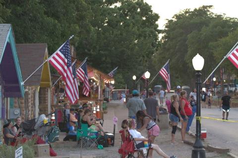 Attendees listen to music during a previous Rock The Park festival and Fourth of July Celebration in Medicine Park. Jeremy Robbins/File Photo