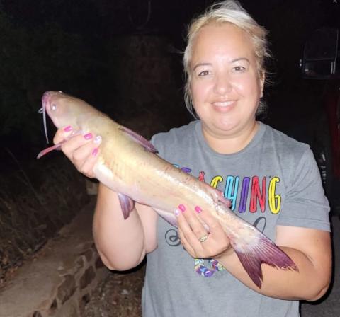 Marie R. with a channel catfish she caught at Lake Lawtonka July 19.  Photo courtesy Oklahoma Department of Wildlife Conservation