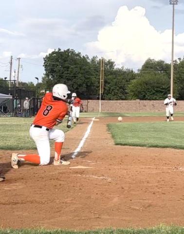Tiger hitter Jayden Huitt hits the ball down the third baseline during the first game of the season against Granite.  Photos by Tania Huitt