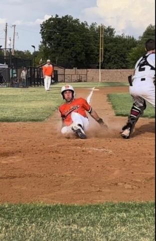 Sterling’s Nate Anderson slides home for one of the Tigers’ four runs in the season opening loss to Granite. Photos by Tania Huitt