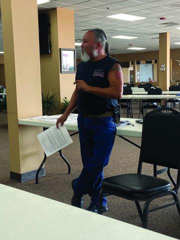 Comanche County Veterans Council Chairman George Keck explains how to  sign up for the Oklahoma Veterans Registry during an Aug. 20 meeting at Bingo  Country in Lawton. Disabled veterans who are exempt from sales taxes must register  with the state by July 1, 2023, to keep the exemption. Eric Swanson/Staff photo