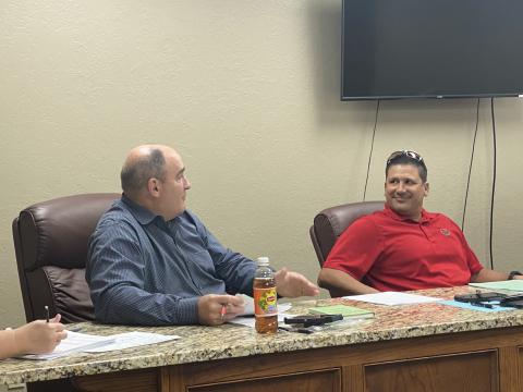 From the left, Elgin City Councilman Sean Bateman speaks while Councilman Fred Guevara listens during a meeting Tuesday at Elgin City Hall. The council created the new position of streets and parks superintendent, which will oversee the city’s street projects among other tasks. Curtis Awbrey/Staff photo