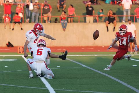 Elgin kicker Gabe Dittmeyer kicks one of his three extra points against Cache. Photo by Hugh Scott Jr.