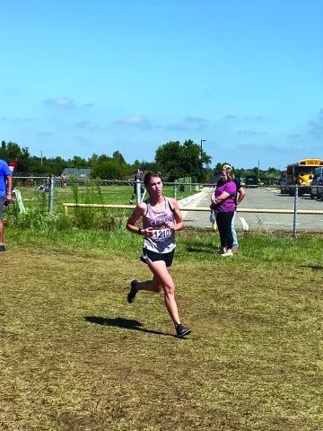 Elgin junior runner Audrey McElhaney wins her second cross-country meet of the season with a first place showing in the elite division of the Carl Albert Invitational on Friday, Sept. 2. Photo by Rick McElhaney