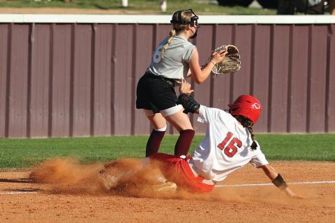Elgin’s Jaemie Johns (16) slides into third on a triple during Tuesday’s game against Blanchard. Elgin lost, 8-6. Photo by Hugh Scott Jr.