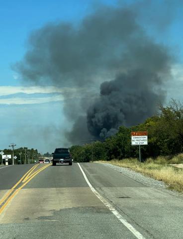 Fire trucks are shown at the scene of a grass fire that broke out Saturday afternoon on Little Bear Loop, east of U.S. Highway 62. Three vacant mobile homes were destroyed in the blaze. Photo courtesy of Comanche County-Lawton Emergency Manaagement