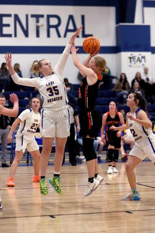 Sterling senior Emma Nunley tries to shoot over the outstretched hands of a Central High defender during Tuesday’s game. Sterling breezed past Central, 55-22, to earn its fourth win of the season. Nunley finished the game with 22 points. PHOTO BY HUGH SCOTT JR.
