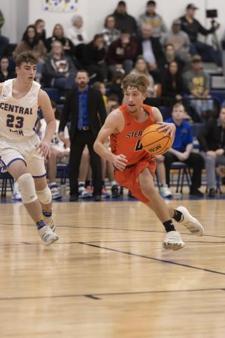 Sterling’s Nate Anderson pushes the ball up court against Central High. Sterling lost that game, but rebounded with a decisive 77-20 win against Cement Tuesday night. PHOTO BY HUGH SCOTT JR.