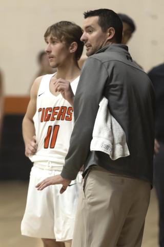 Sterling head coach Trent Parrish gives instructions to senior Nate Anderson during the Dec. 16 game against Apache. HUGH SCOTT JR. | SOUTHWEST CHRONICLE