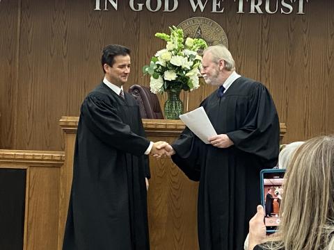 From the left, Comanche County District Judge Grant Sheperd shakes hands with District Judge Emmit Tayloe after Sheperd was sworn into office Monday at the Comanche County Courthouse. ERIC SWANSON | SOUTHWEST CHRONICLE