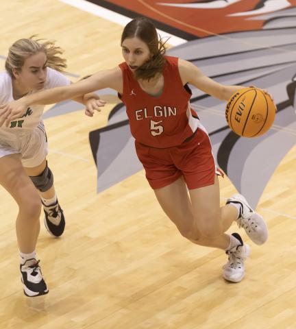 Senior Lizzie Peak (5) dribbles toward the basket during the McGuinness game last week. Elgin won the consolation championship title 51-39 at the Weatherford Classic. HUGH SCOTT JR. | SOUTHWEST CHRONICLE
