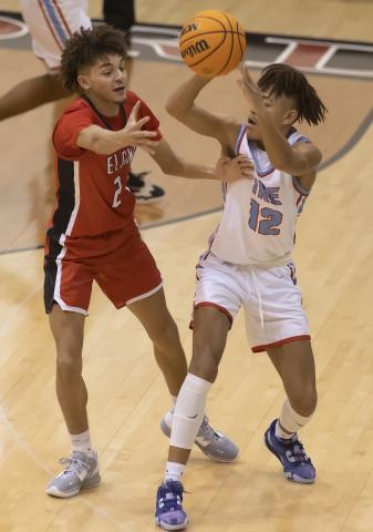 Elgin senior Jaylen Nettles defends against a Lawton Ike player during Friday's action. The Owls will play Piedmont 2:30 p.m. Saturday in the consolation finals of the Weatherford Classic. HUGH SCOTT JR. | SOUTHWEST CHRONICLE