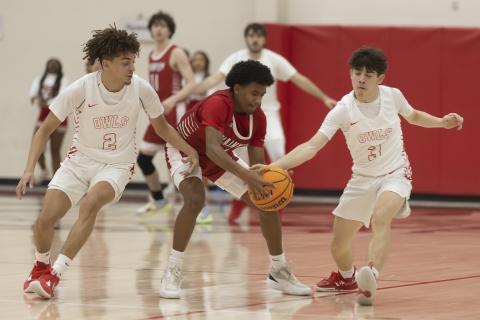 Elgin guards Jaylon Nettles (2) and Nicholas Meraz (3) try to steal the ball from a Plainview defender during last week’s Purcell Tournament. HUGH SCOTT JR. | SOUTHWEST CHRONICLE