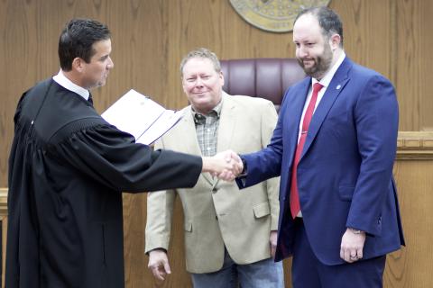 From the left, District Judge Grant Sheperd administers the oath of office to commissioners John O’Brien and Josh Powers Dec. 30, 2022, in the jury room on the second floor of the courthouse. O’Brien and Powers pledged to support the U.S. Constitution, the Oklahoma Constitution and federal and state laws. CARL LEWIS | SOUTHWEST CHRONICLE
