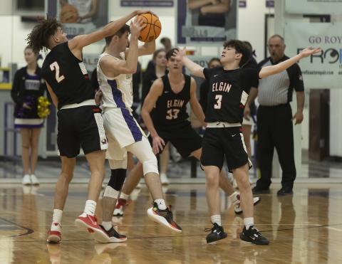 Senior point guard Jaylon Nettles grabs the ball and Elgin teammate Nicholas Meraz blocks the passing lane as a Community Christian player tries to maintain possession of the ball. HUGH SCOTT JR. | SOUTHWEST CHRONICLE
