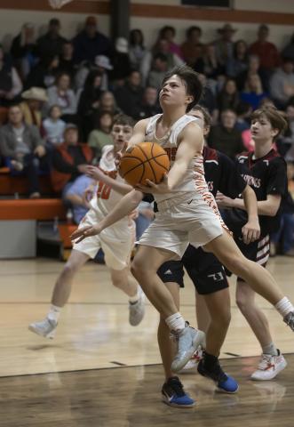 Tukker Hughes (10) drives toward the basket against Rush Springs last Friday. The 55-33 win for Sterling improved its record to 15-7.  HUGH SCOTT JR. | SOUTHWEST CHRONICLE