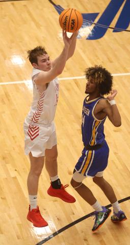 Elgin’s Tres Lorah takes a three-point shot during the Area Tournament game against Classen SAS. Classen defeated Elgin 50-39 and eliminated the Owls from the Class 4A playoffs. HUGH SCOTT JR. | SOUTHWEST CHRONICLE