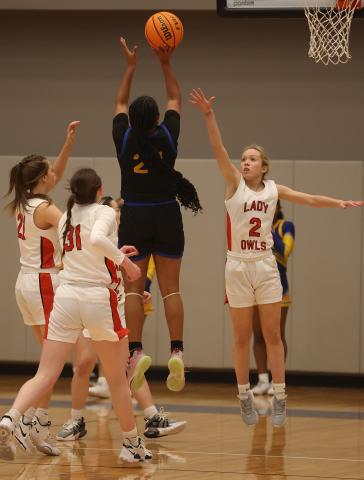 Elgin senior Kenley York guards a Classen SAS player during the Area Tournament March 2 in Hennessey. Classen powered past Elgin 49-27. HUGH SCOTT JR. | SOUTHWEST CHRONICLE